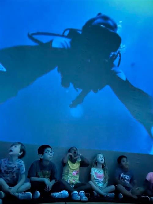 Students in planetarium